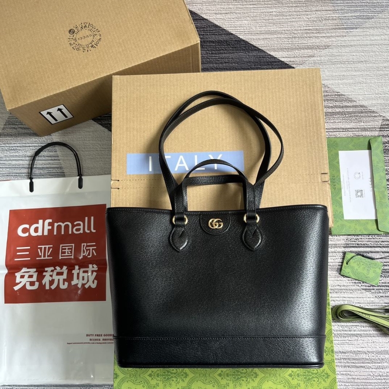 G*u*i shopping bags